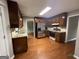 Kitchen featuring stainless steel appliances, granite countertops, and dark wood cabinets at 716 Wilkes Dr, Loganville, GA 30052