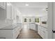 A spacious kitchen featuring white cabinetry, granite countertops, and stainless steel appliances at 3229 Broadnax Mill Rd # 4, Loganville, GA 30052