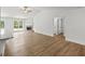Bright living room with a vaulted ceiling, fireplace, and wood-look flooring, perfect for entertaining at 3229 Broadnax Mill Rd # 4, Loganville, GA 30052