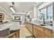Stylish kitchen boasts marble countertops, stainless steel appliances, and wood cabinets at 215 Calgary Dr., Peachtree City, GA 30269