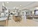 Spacious kitchen with central island, modern appliances, and open layout to living space at 215 Calgary Dr., Peachtree City, GA 30269