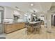 Modern kitchen features two-tone cabinets, marble countertops, a large island, and stainless steel appliances at 215 Calgary Dr., Peachtree City, GA 30269
