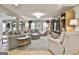 Spacious living room features a large sectional sofa, decorative rug, and custom built-in shelving at 215 Calgary Dr., Peachtree City, GA 30269