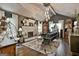 Charming living room featuring a fireplace, hardwood floors, and vaulted ceiling with eclectic decor at 215 Calgary Dr., Peachtree City, GA 30269