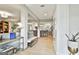 Open-concept space flows from living room to kitchen with seamless design and wood floors at 215 Calgary Dr., Peachtree City, GA 30269