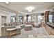 Bright and airy living room showcasing a large sectional sofa, open layout, and modern decor at 215 Calgary Dr., Peachtree City, GA 30269