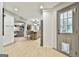 Light and airy open concept showcasing the kitchen and living area with modern finishes and bright lighting at 215 Calgary Dr., Peachtree City, GA 30269