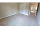 Bedroom featuring double door closet, neutral walls, and carpet flooring at 542 Hinton Farm Way, Dacula, GA 30019
