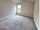 Bedroom with neutral walls and carpet flooring at 542 Hinton Farm Way, Dacula, GA 30019