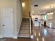 Carpeted stairs leading to open concept kitchen area with modern appliances at 542 Hinton Farm Way, Dacula, GA 30019