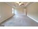 Spacious main bedroom with neutral walls and plush carpeting at 542 Hinton Farm Way, Dacula, GA 30019