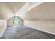 Bright finished attic space with neutral walls, recessed lighting, and patterned carpet at 146 Calico Loop, Grantville, GA 30220