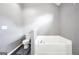 Bathroom with large bathtub, tile flooring, and a neutral color scheme at 146 Calico Loop, Grantville, GA 30220