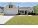 Charming one story home with a well manicured lawn and covered front porch during the day at 146 Calico Loop, Grantville, GA 30220