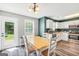 Open kitchen and dining area with natural light and stainless steel appliances at 146 Calico Loop, Grantville, GA 30220
