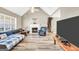 Cozy living room with fireplace, vaulted ceiling, hardwood floors, and comfortable seating at 146 Calico Loop, Grantville, GA 30220