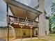 A covered back porch offers an outdoor space for relaxation and entertaining, supported by sturdy wooden beams at 147 Tara Blvd, Loganville, GA 30052