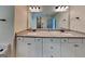 This bathroom boasts double sinks, granite counters, and plenty of cabinet space at 147 Tara Blvd, Loganville, GA 30052