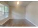Bright bedroom with hardwood floors, a large window and neutral paint for a cozy feel at 147 Tara Blvd, Loganville, GA 30052