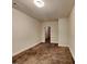 A vacant bedroom is seen with brown carpet and off-white walls at 147 Tara Blvd, Loganville, GA 30052
