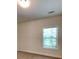 This is an unfurnished bedroom with a window at 147 Tara Blvd, Loganville, GA 30052
