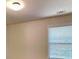 This bedroom has beige walls, carpet and a large window at 147 Tara Blvd, Loganville, GA 30052