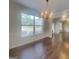Elegant dining room featuring wainscoting, hardwood floors, and a chandelier at 147 Tara Blvd, Loganville, GA 30052