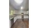 Well-lit kitchen with modern stainless steel appliances and granite countertops at 147 Tara Blvd, Loganville, GA 30052