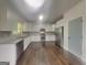 Bright kitchen featuring stainless steel appliances, granite countertops, and hardwood floors at 147 Tara Blvd, Loganville, GA 30052
