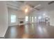 Spacious living room with a fireplace, coffered ceiling and hardwood floors at 147 Tara Blvd, Loganville, GA 30052