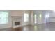 Bright living room with a fireplace and large windows allowing for abundant natural light at 147 Tara Blvd, Loganville, GA 30052