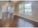 Open concept living space with gleaming hardwood floors and bright, natural light at 147 Tara Blvd, Loganville, GA 30052