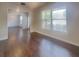 Open living area with hardwood floors and large windows providing plenty of natural light at 147 Tara Blvd, Loganville, GA 30052