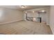 This large loft area has a tiled floor and a railing overlooking the first floor at 147 Tara Blvd, Loganville, GA 30052