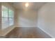 Bright room with hardwood floors and large windows that provide plenty of natural light at 147 Tara Blvd, Loganville, GA 30052
