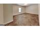 Unfinished room, with neutral paint and single window at 147 Tara Blvd, Loganville, GA 30052