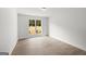 Bedroom featuring neutral paint, wood floors, and a window overlooking landscaping at 3209 Broadnax Mill Rd # 6, Loganville, GA 30052