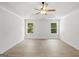 Bright bedroom boasts wood-look flooring and white trim around windows that let in natural light at 3209 Broadnax Mill Rd # 6, Loganville, GA 30052