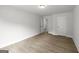 Bedroom featuring neutral paint, wood floors, and two doors at 3209 Broadnax Mill Rd # 6, Loganville, GA 30052