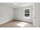 Bedroom featuring neutral paint, wood floors, and natural light at 3209 Broadnax Mill Rd # 6, Loganville, GA 30052