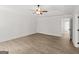 This bedroom features wood-look flooring, white trim, and a door that leads to another room in the home at 3209 Broadnax Mill Rd # 6, Loganville, GA 30052