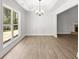Bright dining room featuring trey ceilings, hardwood floors, and large windows at 3209 Broadnax Mill Rd # 6, Loganville, GA 30052