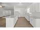 Modern kitchen with white cabinets, granite counters, stainless steel appliances, and kitchen island at 3209 Broadnax Mill Rd # 6, Loganville, GA 30052