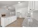 Beautiful kitchen featuring granite countertops, white cabinetry, and a bright airy design at 3209 Broadnax Mill Rd # 6, Loganville, GA 30052