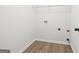 Empty laundry room featuring wood floors and hookups at 3209 Broadnax Mill Rd # 6, Loganville, GA 30052