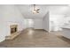Spacious living area with fireplace, tile flooring, and flowing layout to kitchen at 3209 Broadnax Mill Rd # 6, Loganville, GA 30052