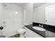 Modern bathroom featuring tub, toilet, and a vanity sink with stylish countertop at 3219 Broadnax Mill Rd # 5, Loganville, GA 30052