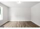 Bright bedroom with hardwood floors, large windows, and fresh paint at 3219 Broadnax Mill Rd # 5, Loganville, GA 30052