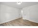 Neutral bedroom featuring wood floors and two door-accessible closets at 3219 Broadnax Mill Rd # 5, Loganville, GA 30052