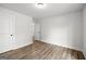 Neutral bedroom featuring wood floors and door-accessible closet at 3219 Broadnax Mill Rd # 5, Loganville, GA 30052
